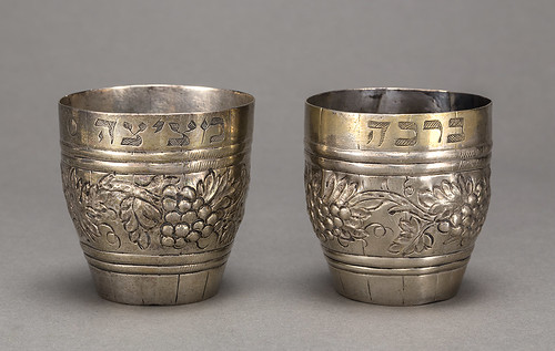 Cups for the circumcision ceremony, decorated with vine motifs, and inscribed in Hebrew kos berakhah