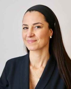 Headshot of woman with long dark hair